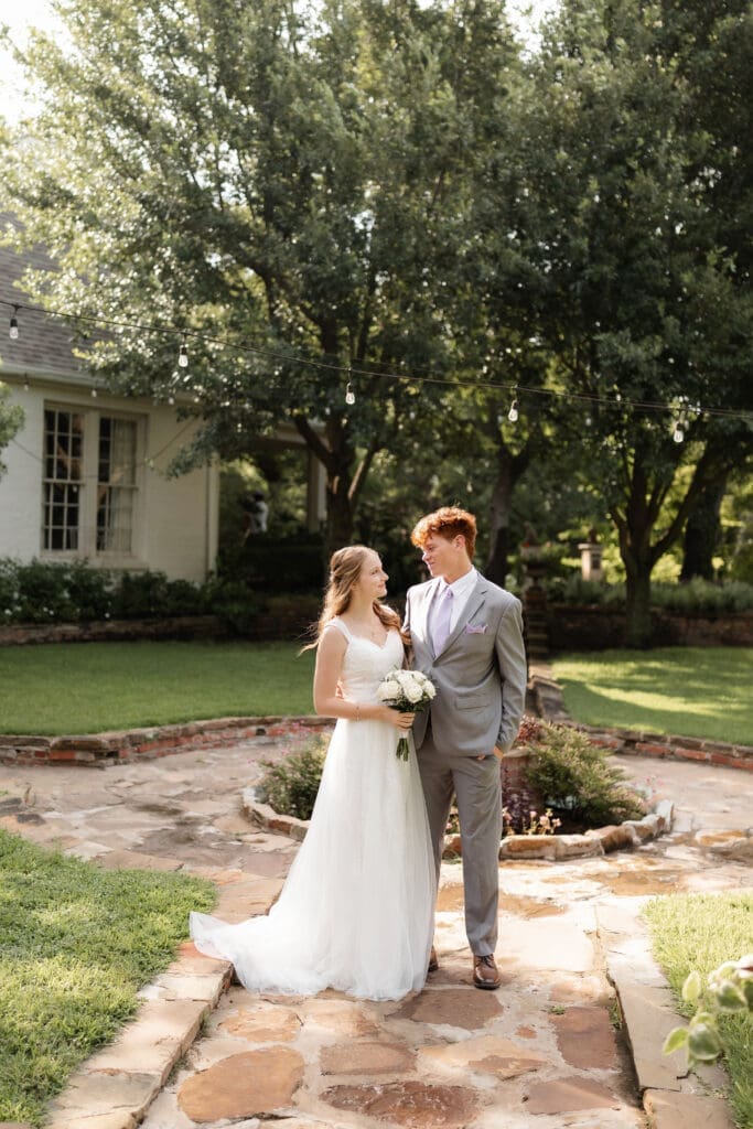 Bride and groom at Chandor Gardens in Weatherford, TX, during their wedding photography session