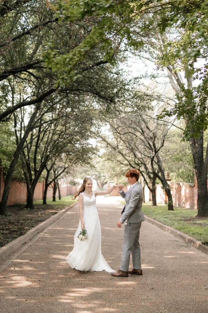 Bride and groom dancing at Chandor Gardens in Weatherford, TX, during their wedding photography session