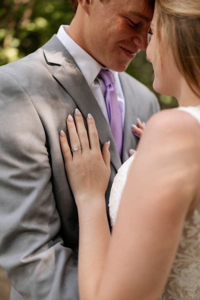 Bride and groom embracing at Chandor Gardens in Weatherford, TX, during their wedding photography session