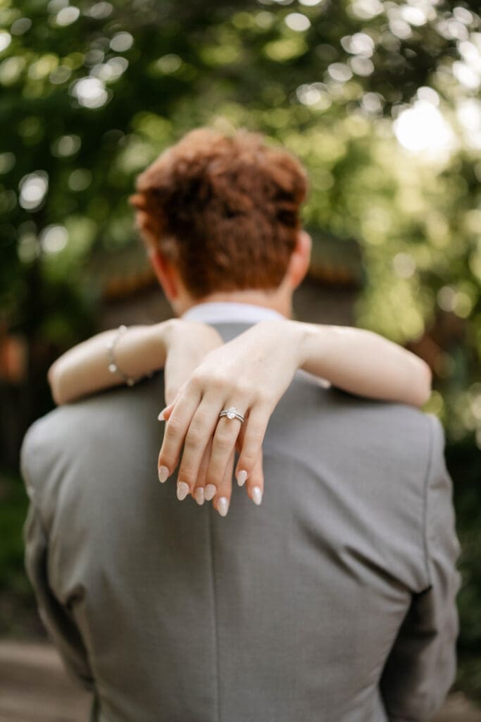 Bride and groom embracing at Chandor Gardens in Weatherford, TX, during their wedding photography session