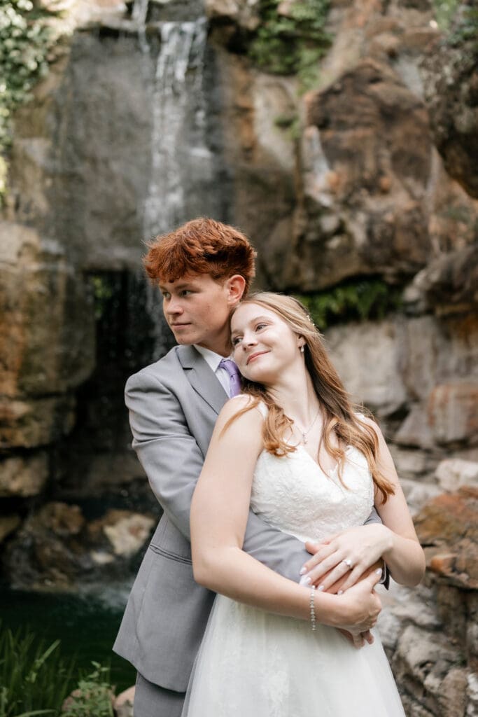 Bride and groom embracing at Chandor Gardens in Weatherford, TX, during their wedding photography session