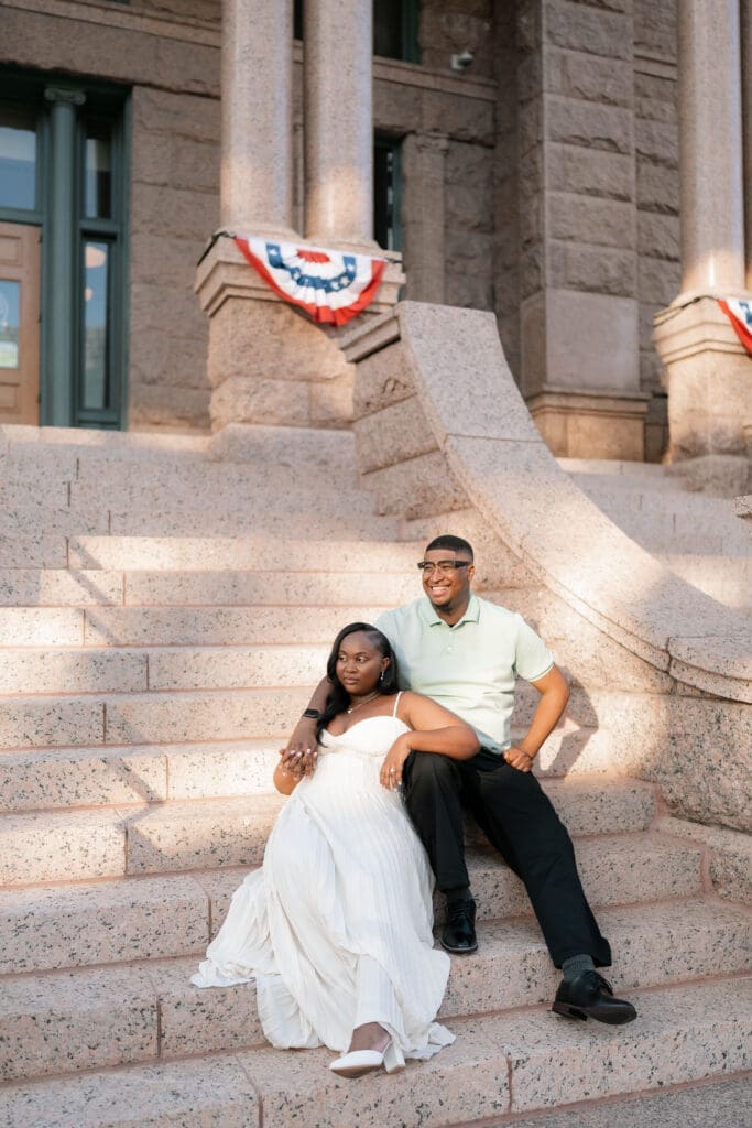 Golden hour Fort Worth engagement photos on the courthouse steps