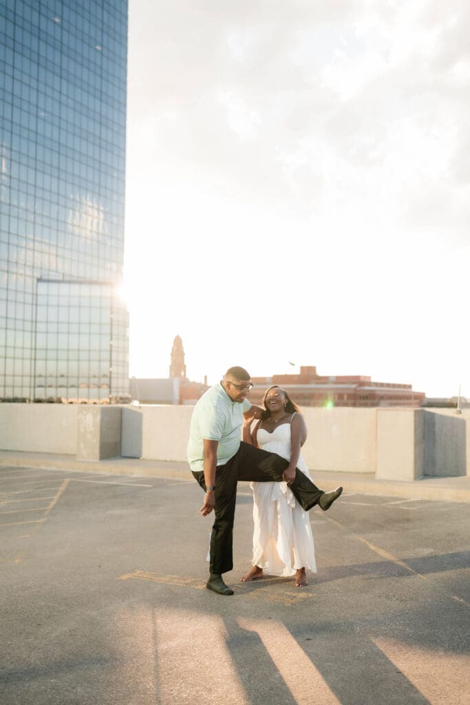 Golden hour rooftop engagement portraits with the Fort Worth skyline