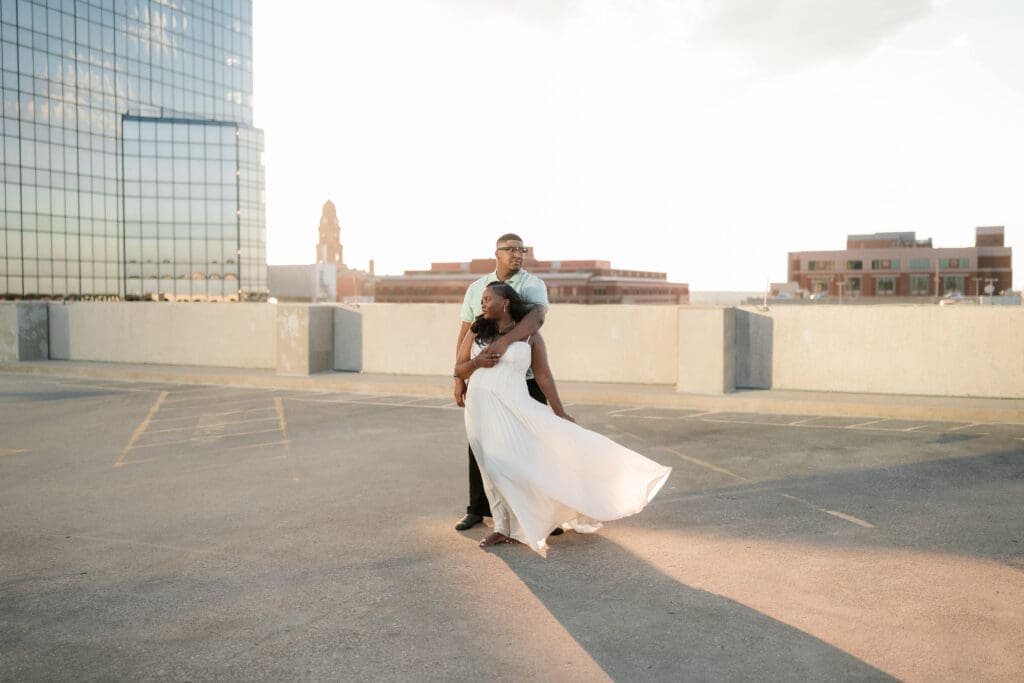 Golden hour rooftop engagement portraits with the Fort Worth skyline