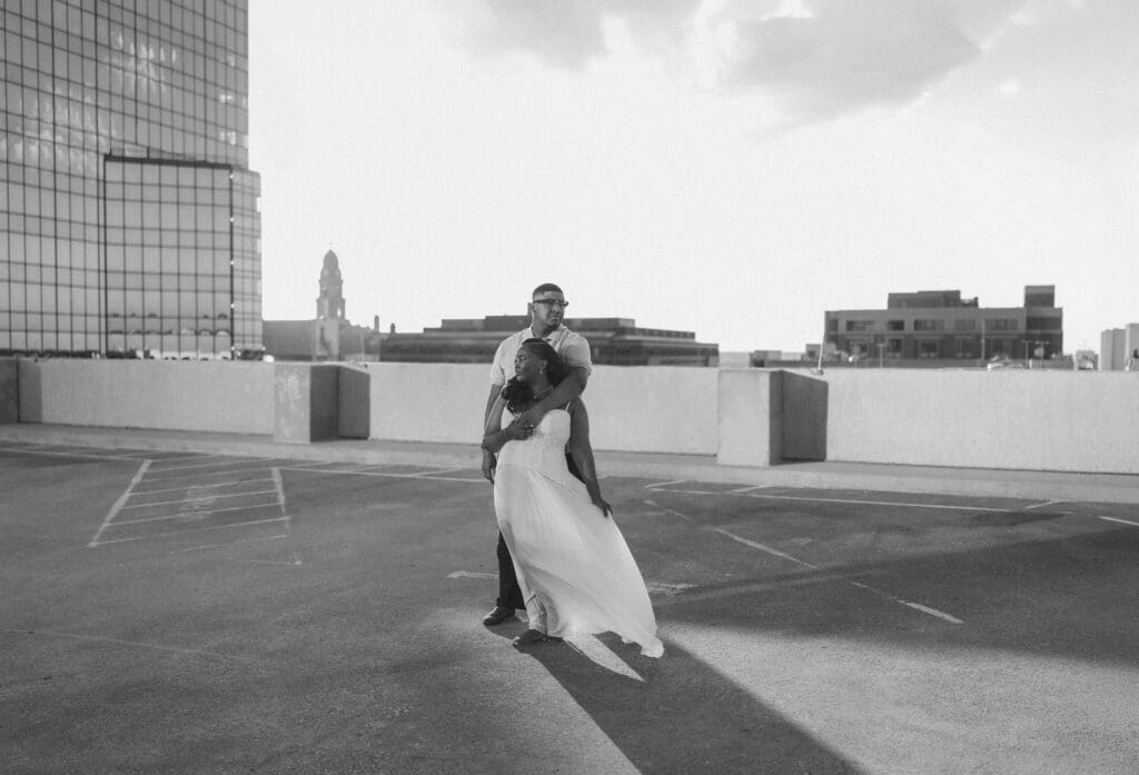 Golden hour rooftop engagement portraits with the Fort Worth skyline