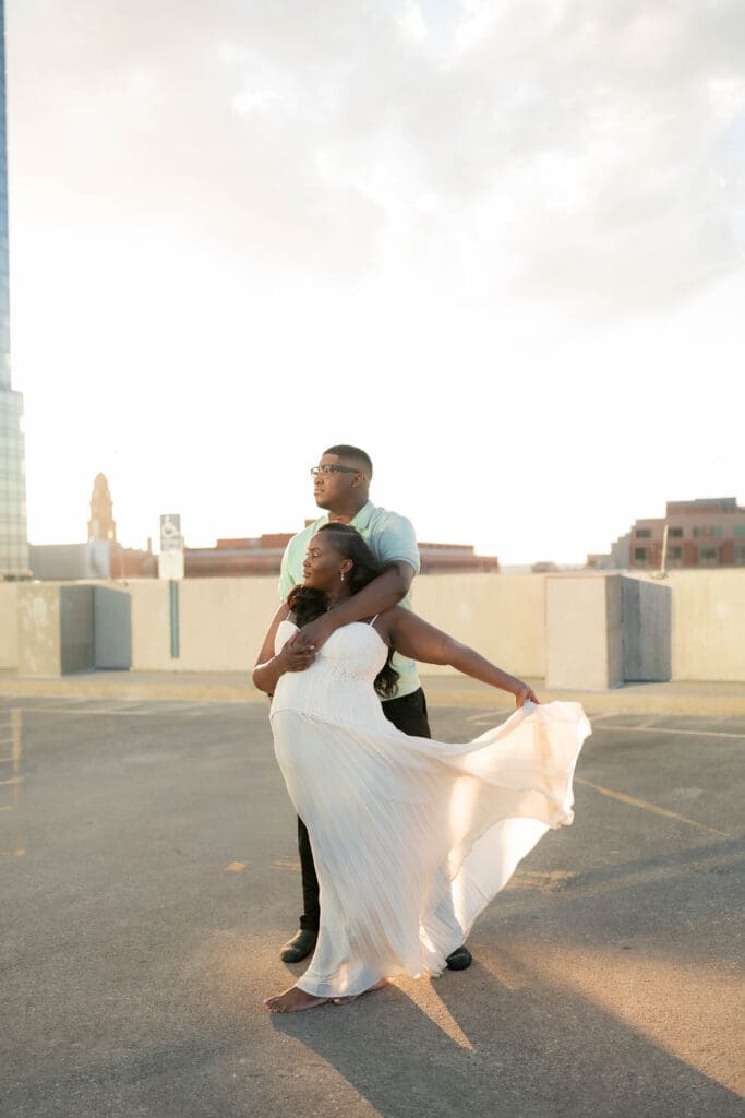 Golden hour rooftop engagement portraits with the Fort Worth skyline