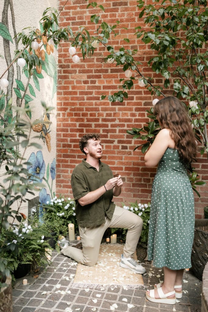 Man proposing to his girlfriend in Sundance Alley in Sundance Square, Fort Worht, TX