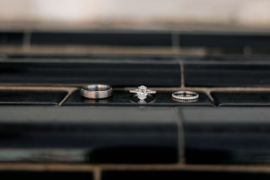 Close-up detail shot of the bride's and groom's rings during their downtown Weatherford, TX wedding