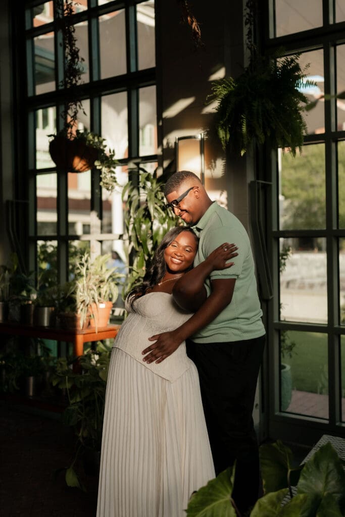 Couple beneath the Sundance Square Pavilion at sunset