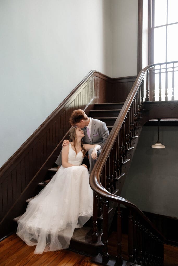 Bride and groom embracing in the Weatherford Courthouse during their elopement