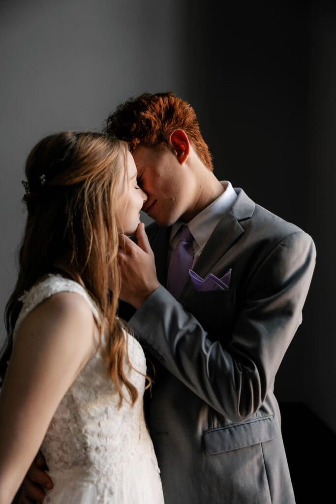 Moody shot of Bride and groom at the Weatherford Courthouse during their elopement