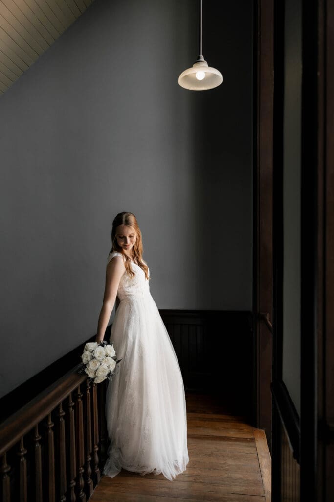 Moody shot of Bride at the Weatherford Courthouse during their elopement