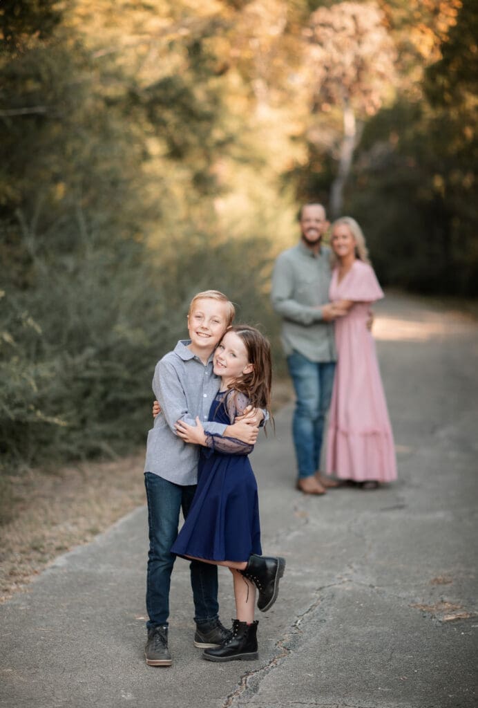 Family posing at Soldier Spring Park in Weatherford during their family photography session