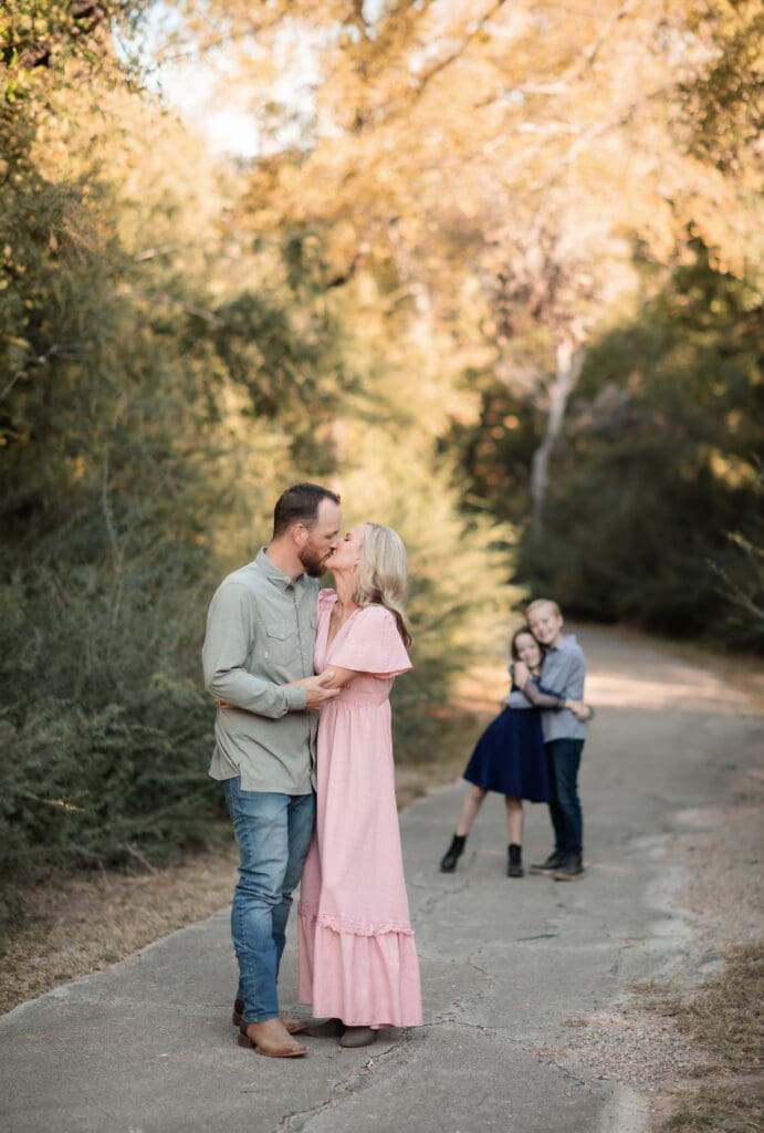 Family posing at Soldier Spring Park in Weatherford during their family photography session