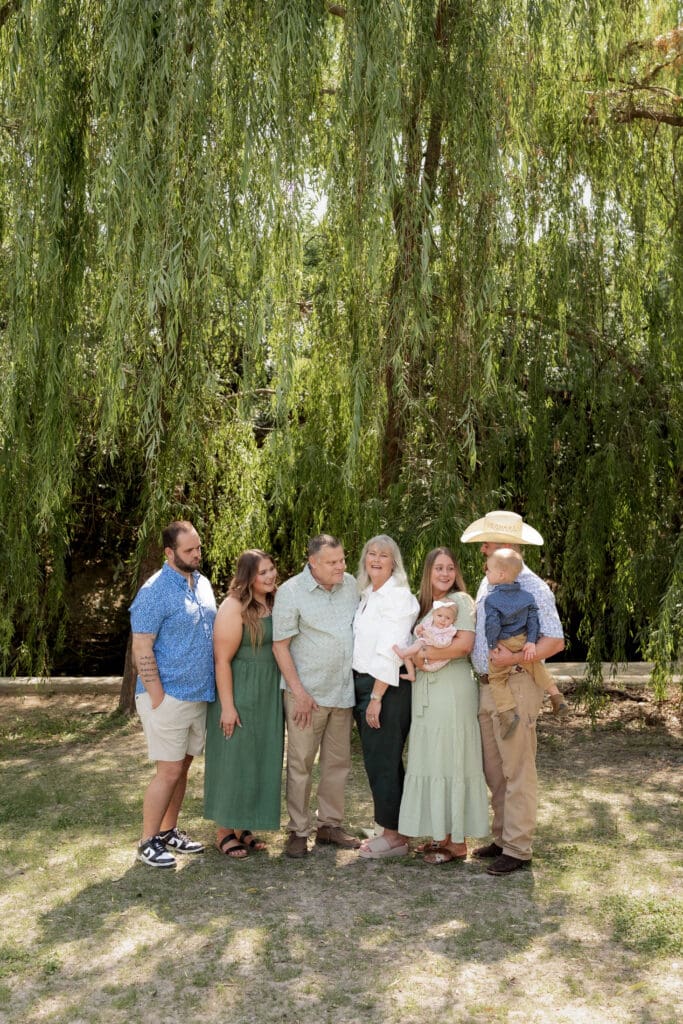 Family having fun during their full family photo session at Airfield Falls in Fort Worth, TX