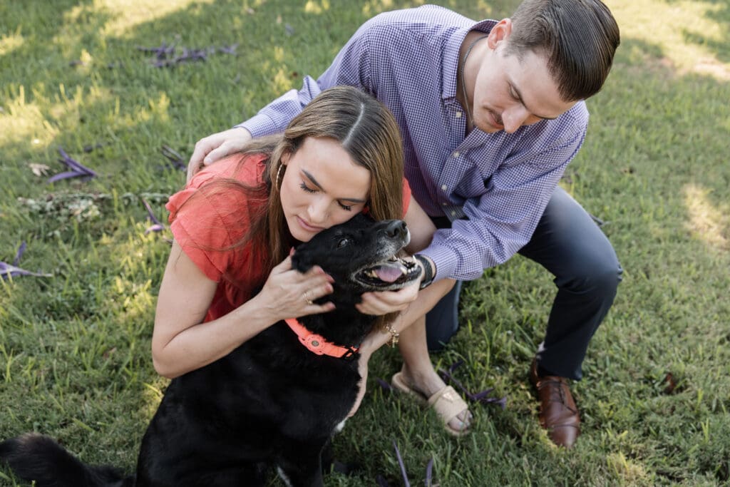 Family cuddling dog during their family session in Fort Worth, TX