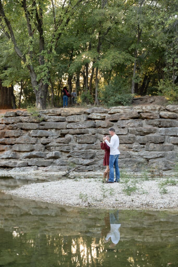 engaged couple dancing at Airfield Falls in Fort Worth