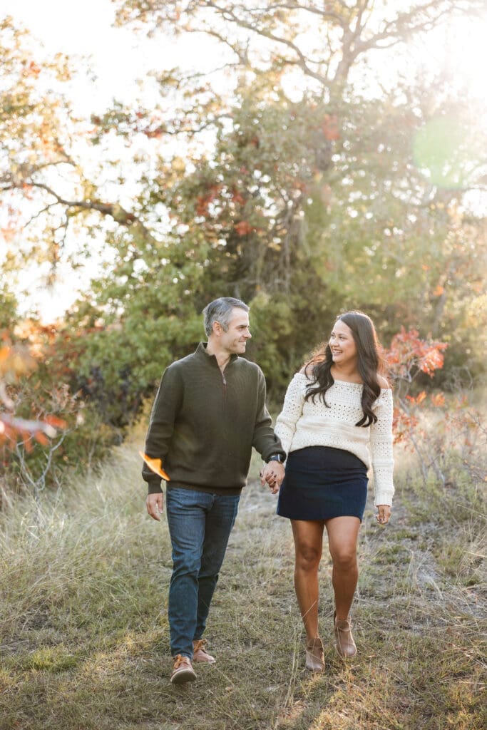 Family holding hands in Soldier Spring Park in Weatherford during their family photography session