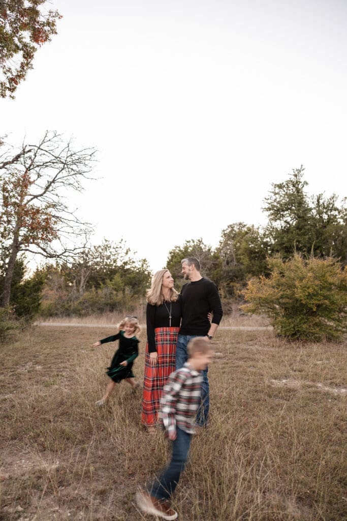 Family posing at Soldier Spring Park in Weatherford during their family photography session