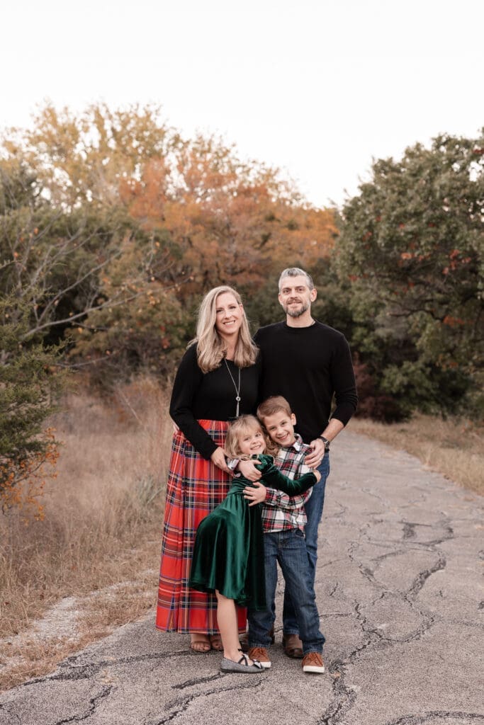Family posing at Soldier Spring Park in Weatherford during their family photography session