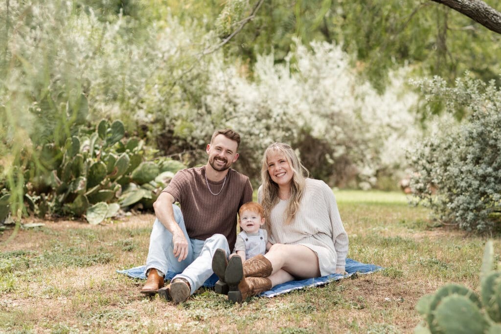 Husband and wife sitting at the Cactus Garden in Fort Worth during their family photography session