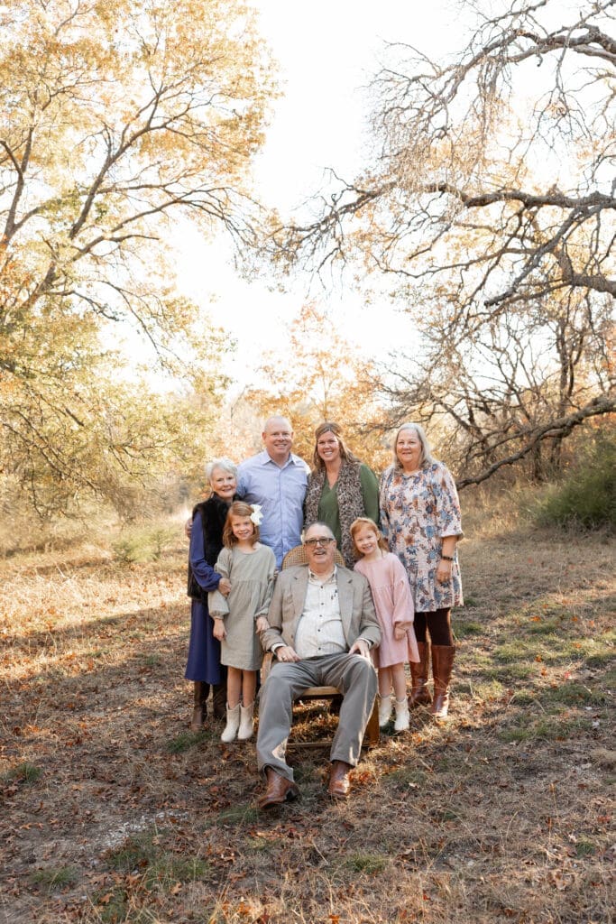 Golden hour Family posing for family portraits at Soldier Spring Park in Weatherford