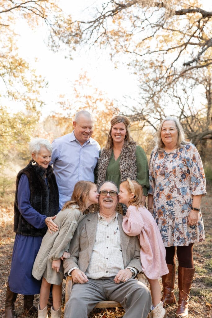 Golden hour Family posing for family portraits at Soldier Spring Park in Weatherford
