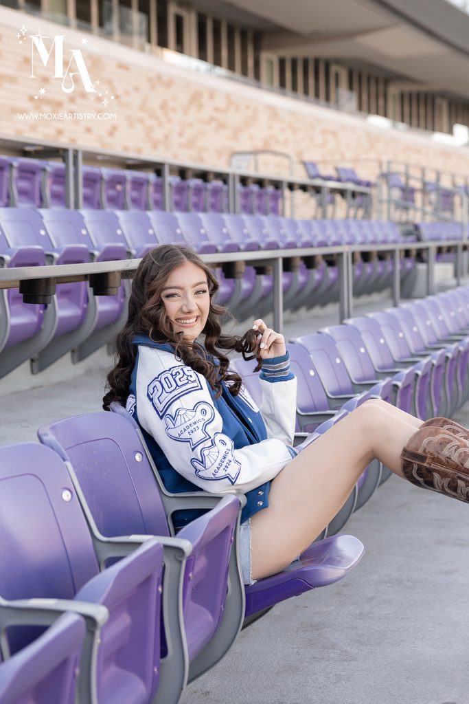 Girl posing during her senior portrait session at the TCU Campus in Fort Worth, TX