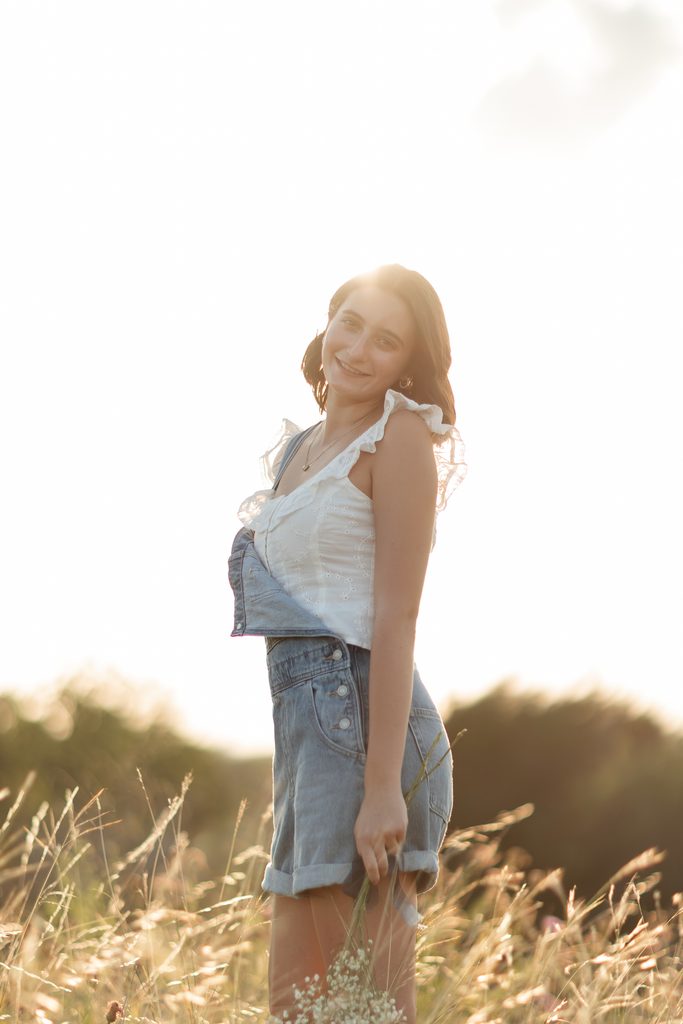 Girl posing at Tandy Hills during her golden hour senior portrait session in Fort Worth, TX