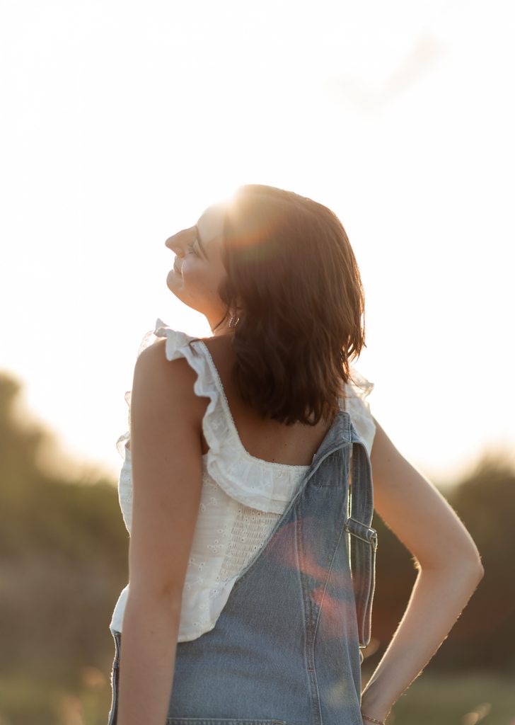 Girl posing at Tandy Hills during her golden hour senior portrait session in Fort Worth, TX