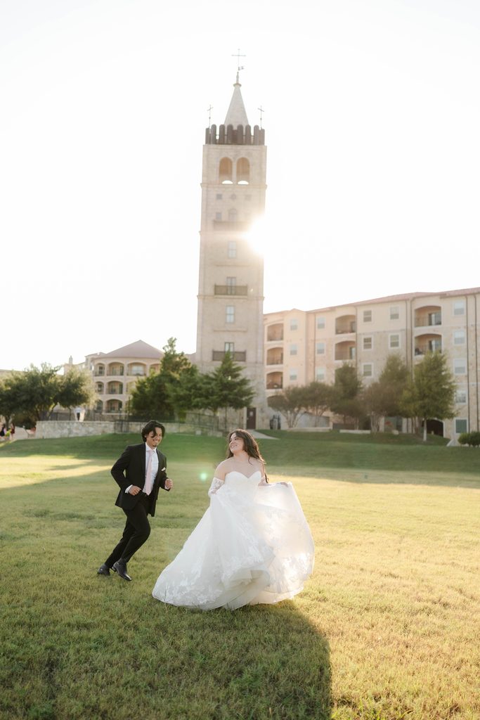 Bride and groom playfully running around at Adriatica Village during their portrait session