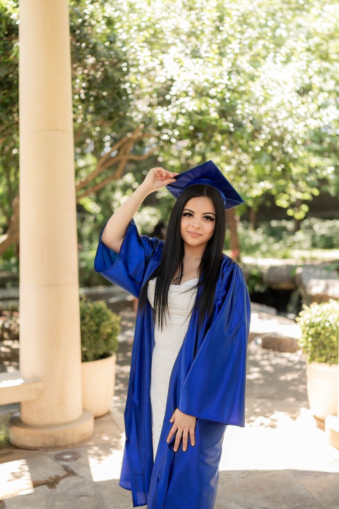 Portrait of girl at the Fort Worth Botanic Garden during her senior portrait session
