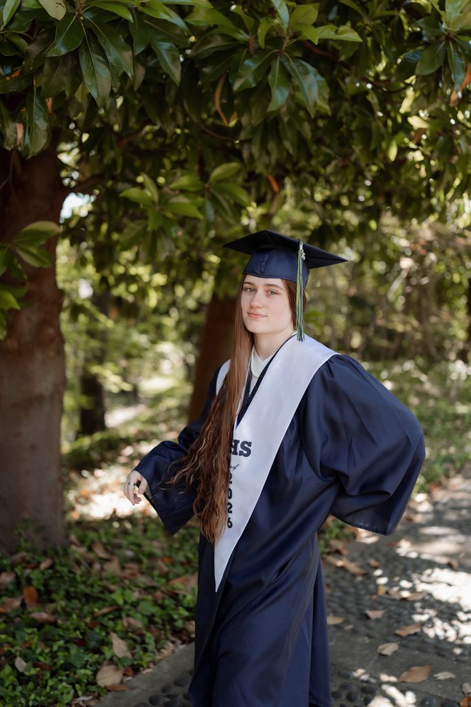 Portrait of girl at the Fort Worth Botanic Garden during her senior portrait session