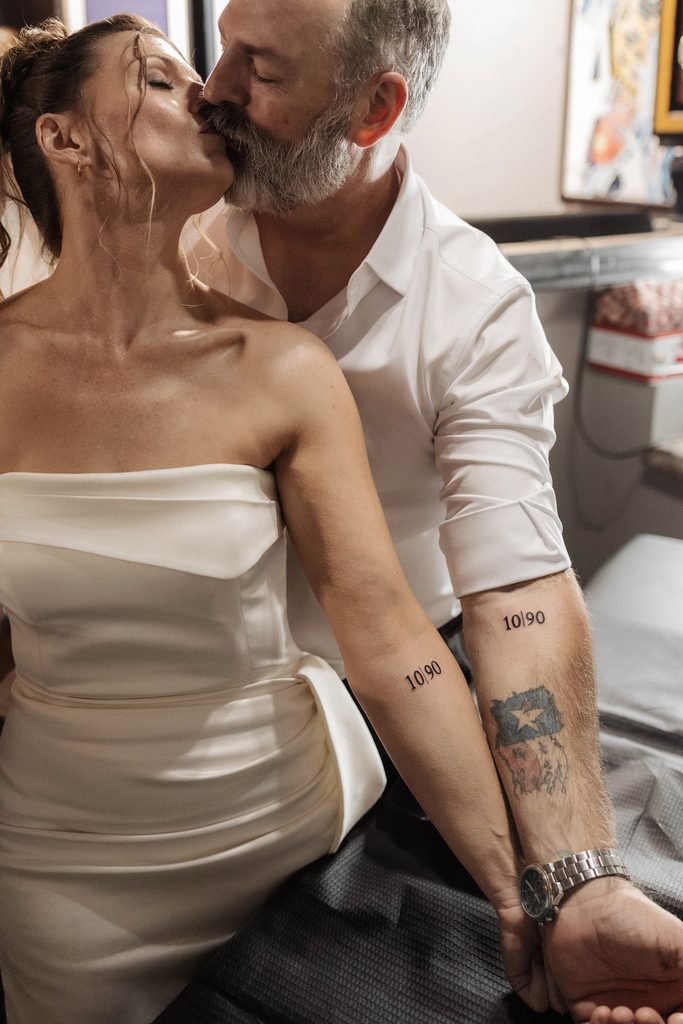 Bride and groom getting tattoos together at Knuckle Up Tattoo shop at the Fort Worth Stockyards