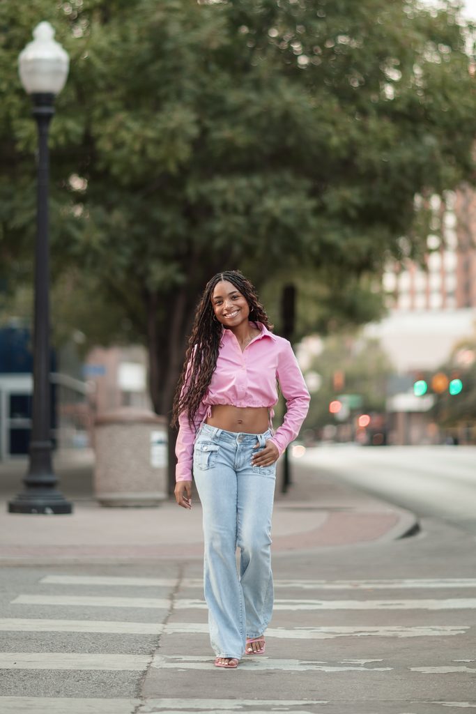Girl crossing the street in color