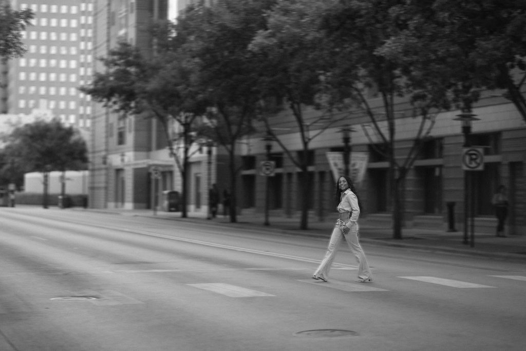 Girl crossing the street in black and white