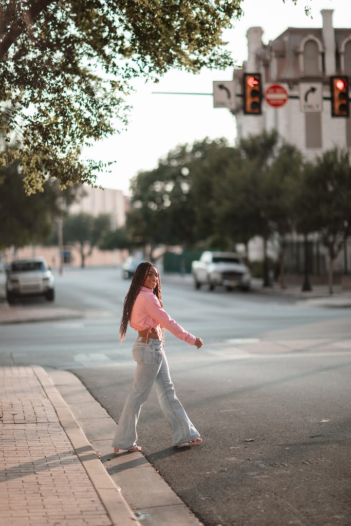 Girl crossing the street in color