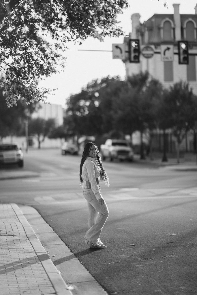 Girl crossing the street in black and white
