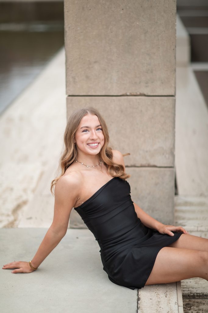 Girl posing at the Kimbell Art Museum during her senior portrait session
