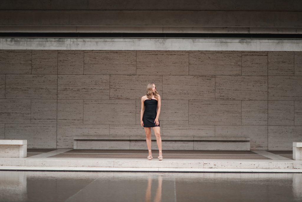 Girl posing at the Kimbell Art Museum during her senior portrait session