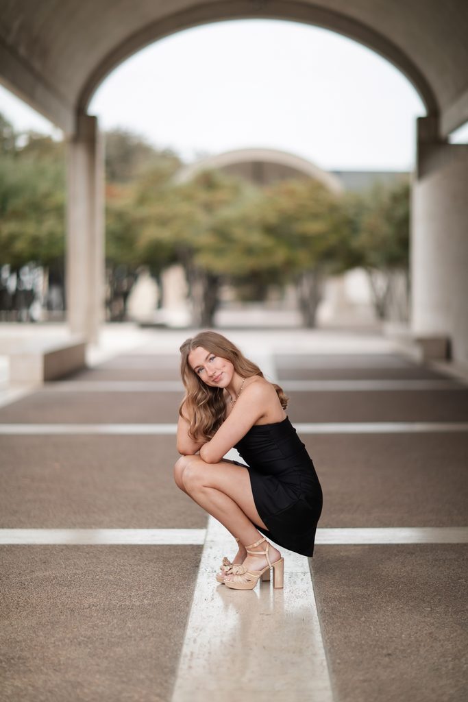 Girl posing at the Kimbell Art Museum during her senior portrait session
