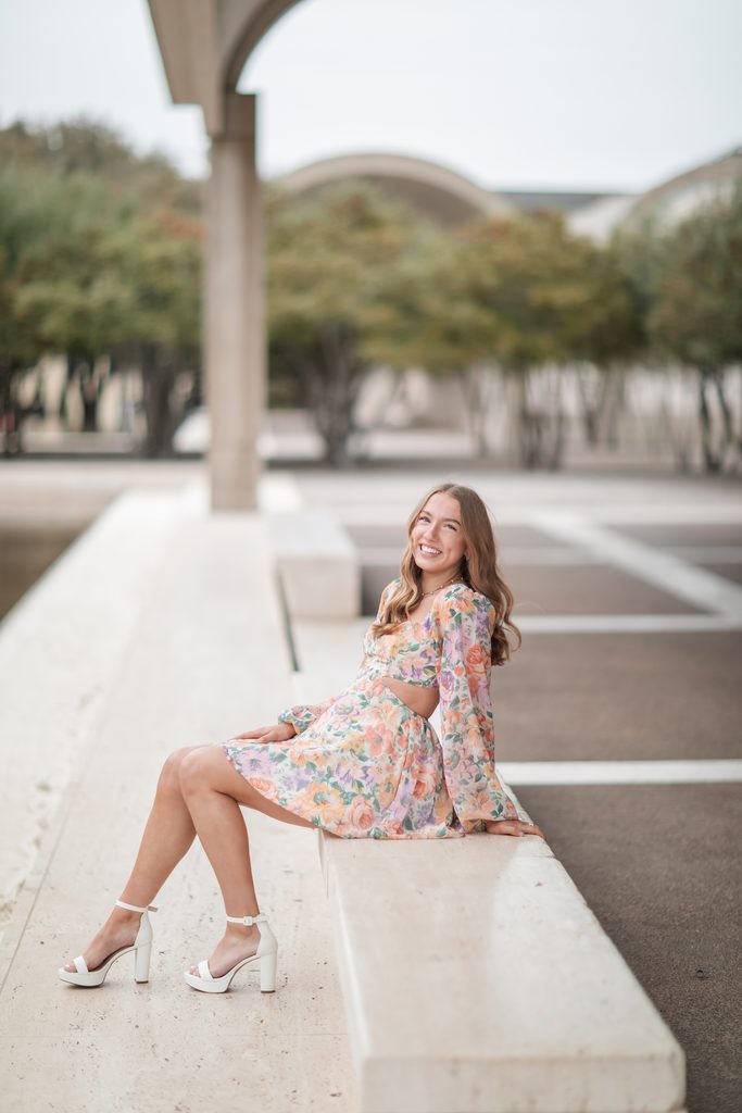 Girl posing at the Kimbell Art Museum during her senior portrait session