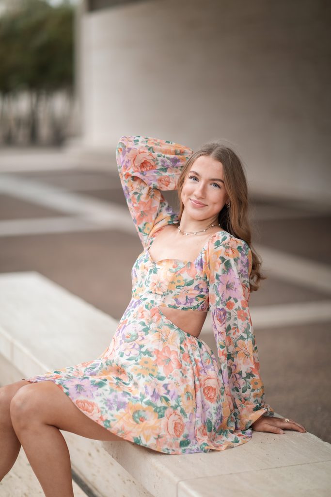 Girl posing at the Kimbell Art Museum during her senior portrait session