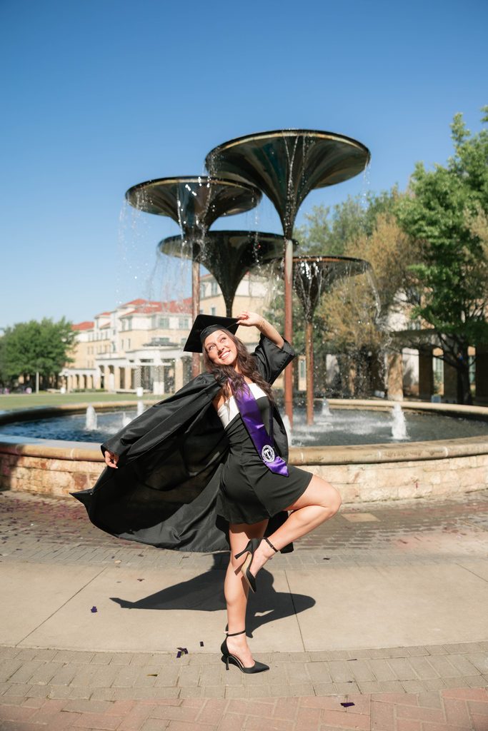 portrait of girl posing during her grad session at the TCU Campus in Fort Worth, TX
