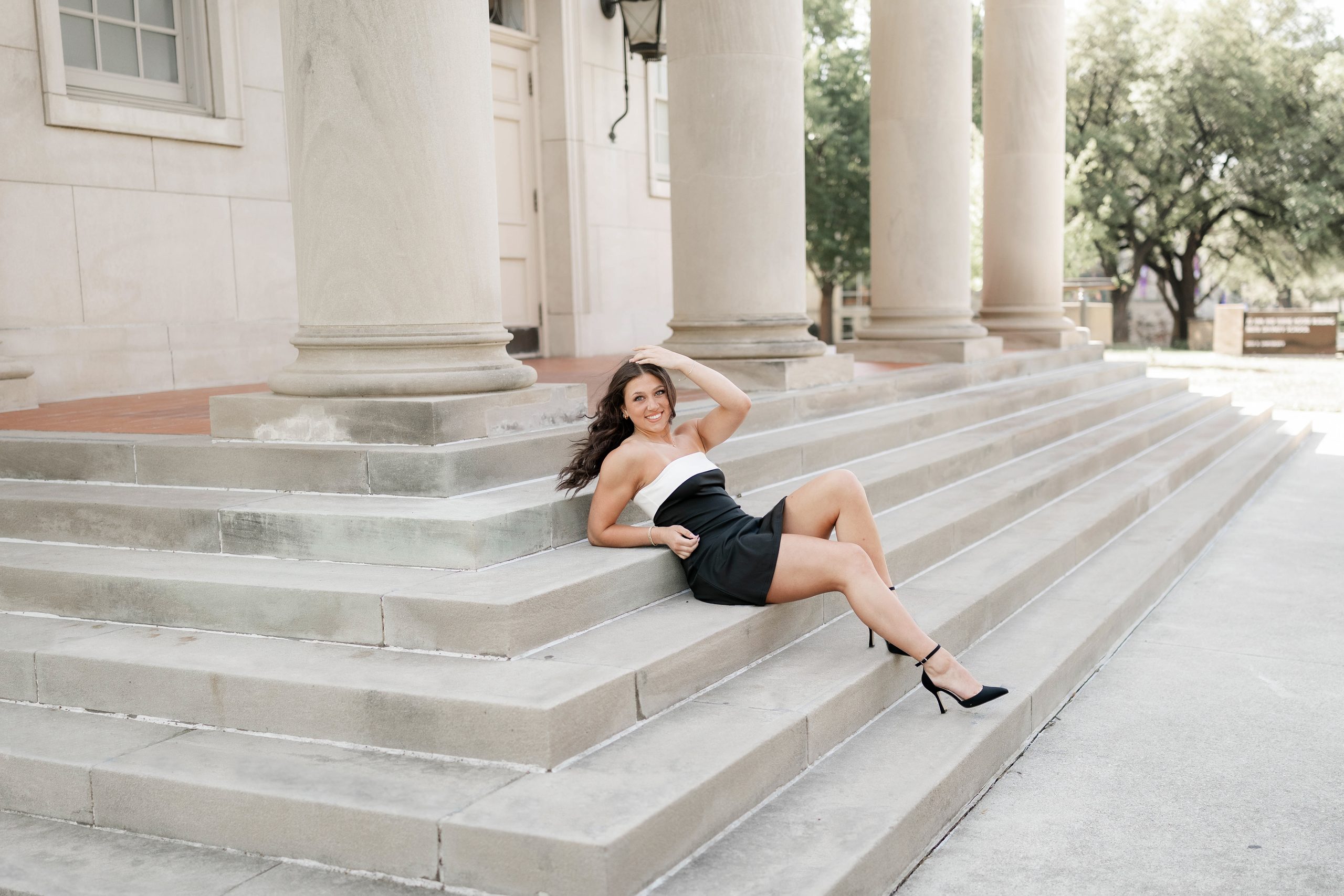 Portrait of a girl sitting on the steps at TCU campus in Fort Worth, TX