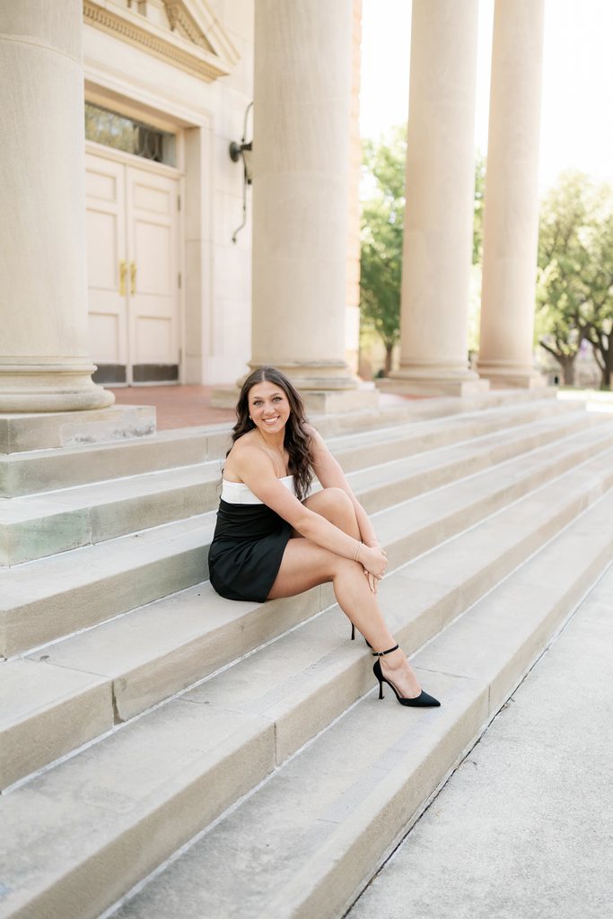 portrait of girl posing during her grad session at the TCU Campus in Fort Worth, TX